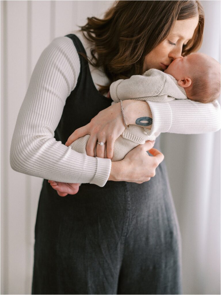 Mom snuggling baby