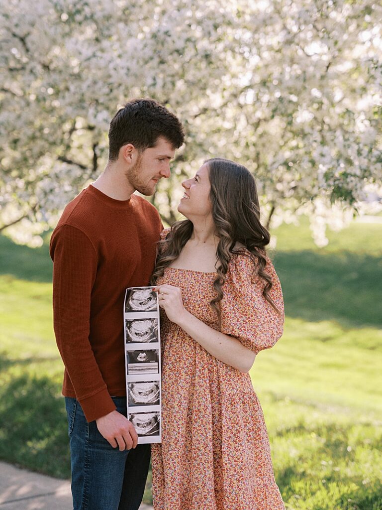 Couple with spring blossom trees