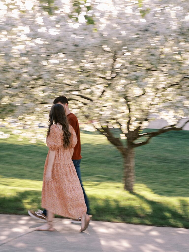 Couple with spring blossom trees