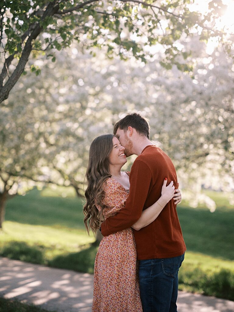 Couple with spring blossom trees