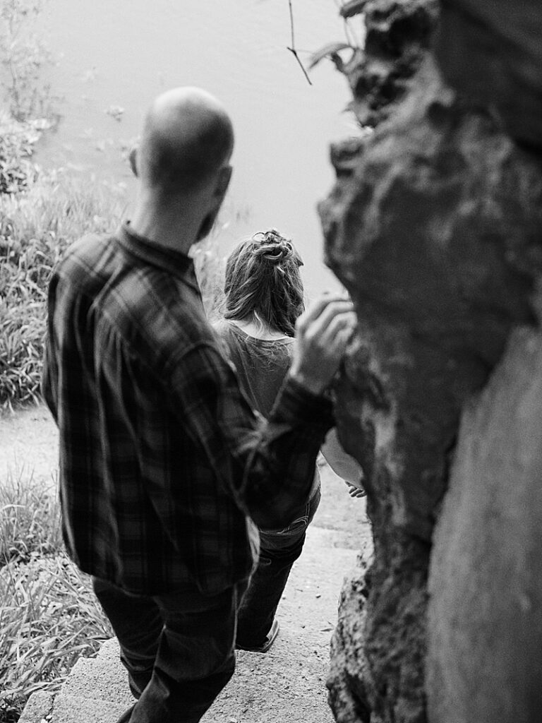 Couple hiking down a trail