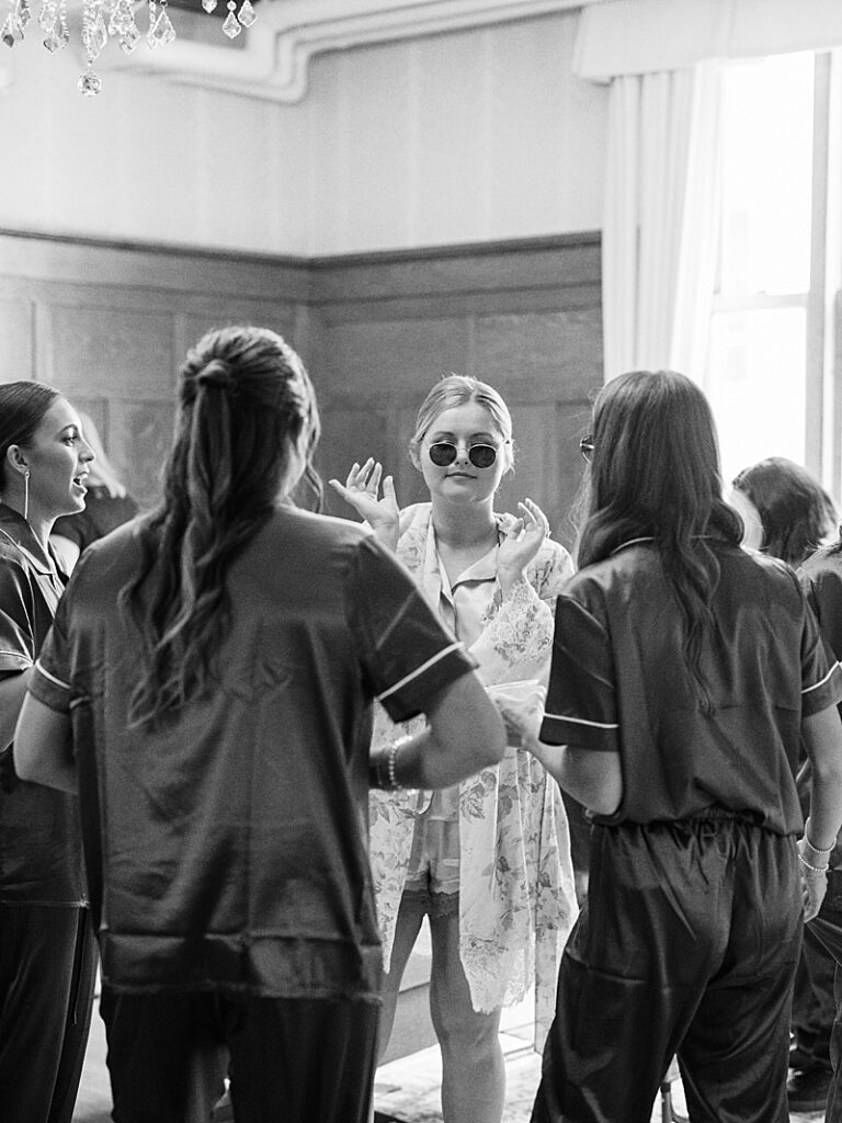 Bride dancing in sunglasses