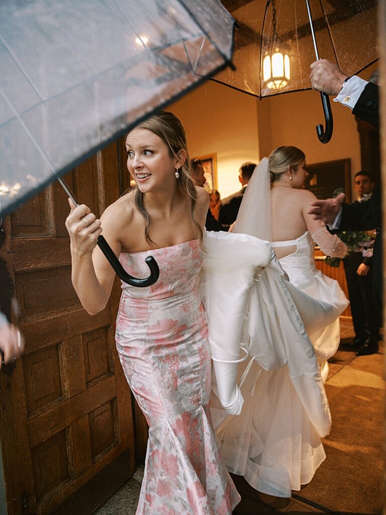 Bridesmaid looking at the rain at St. Ambrose Cathedral in Des Moines